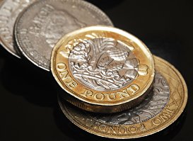Монеты Великобритании номиналом один фунт стерлингов.