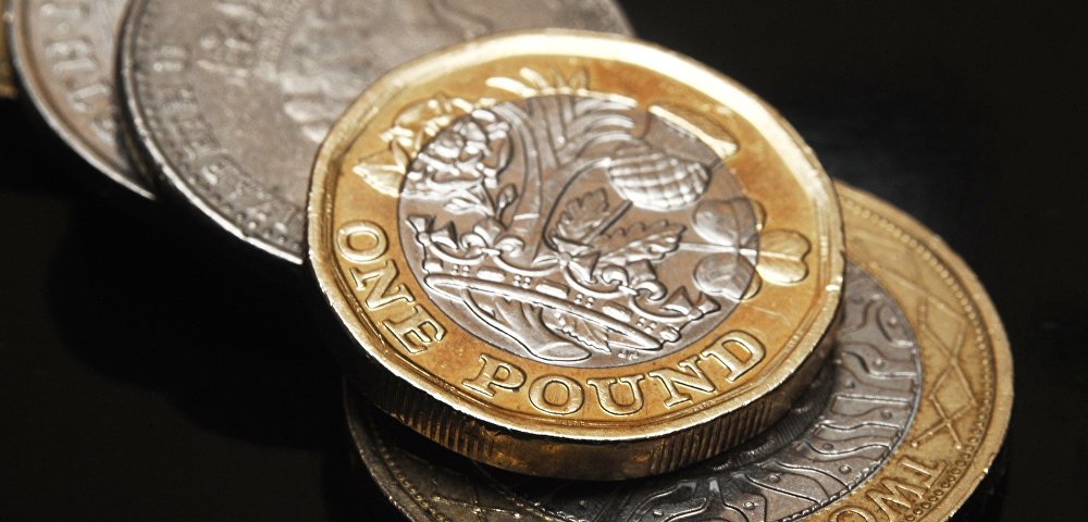 Монеты Великобритании номиналом один фунт стерлингов.