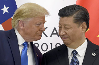 Президент США Дональд Трамп и председатель КНР Си Цзиньпин во время встречи на саммите G20 в Осаке, 29 июня 2019